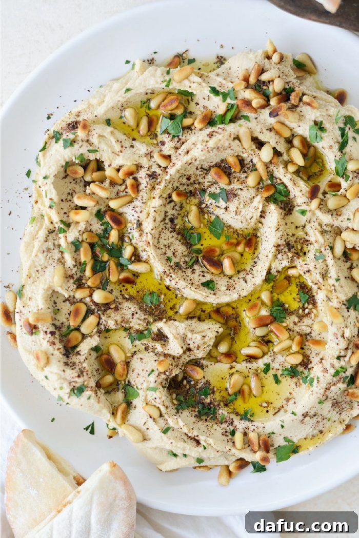 Velvet Smooth Blender Hummus 2 Silky smooth homemade blender hummus garnished with olive oil and spices