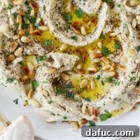 Creamy Blender Hummus garnished with olive oil