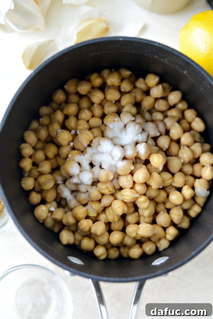 Velvet Smooth Blender Hummus 5 Drained chickpeas and baking soda in a saucepan