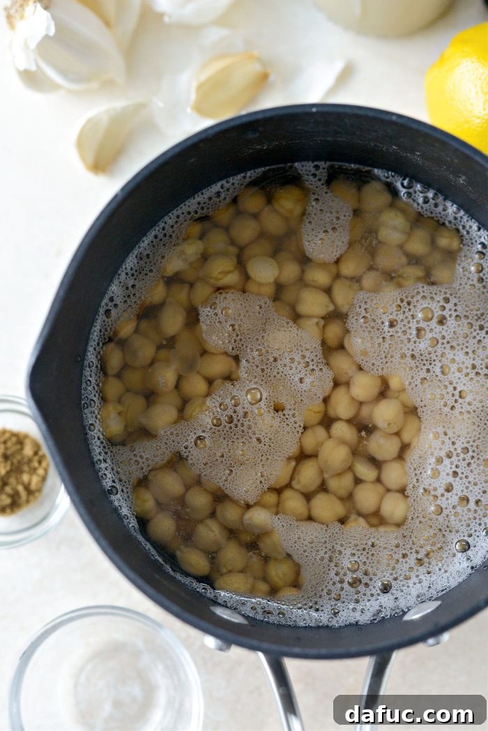 Velvet Smooth Blender Hummus 6 Chickpeas in a pot covered with water