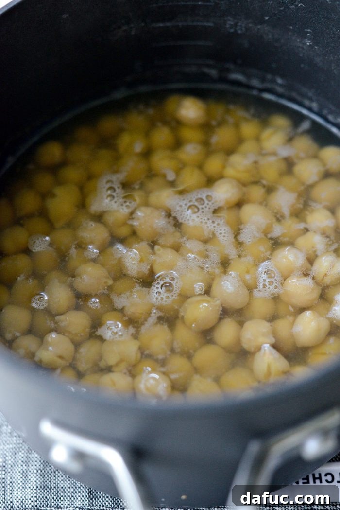 Velvet Smooth Blender Hummus 7 Chickpeas simmering in a pot for 25 minutes