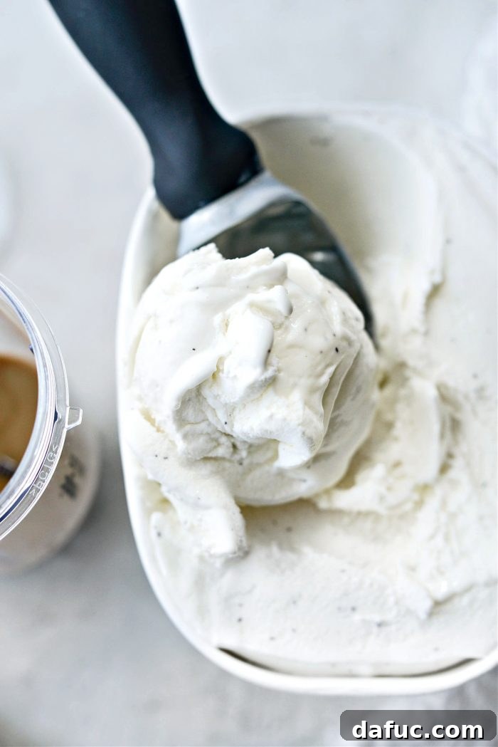 Espresso Cookies and Cream Milkshake 9 A generous scoop of vanilla ice cream being added to the blender.