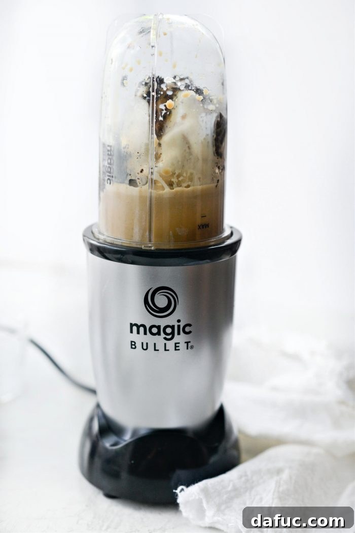 Espresso Cookies and Cream Milkshake 10 Blender with ingredients for Espresso Cookies and Cream Milkshake being blended until smooth.