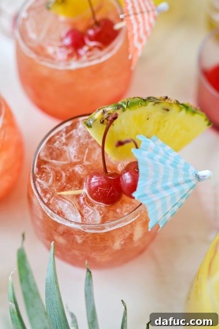 Tropical Tequila Sunrise Shandy 16 A close-up of a refreshing Pineapple Tequila Sunrise Shandy, ready for sipping