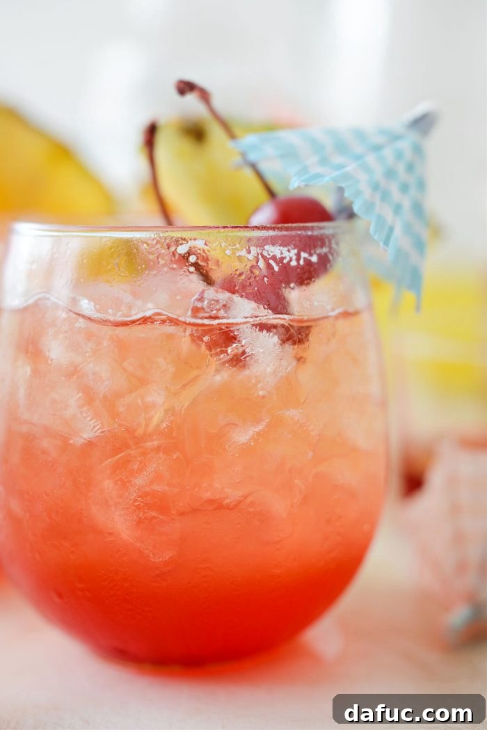 Tropical Tequila Sunrise Shandy 18 A captivating view of Pineapple Tequila Sunrise Shandy cocktails, artfully arranged