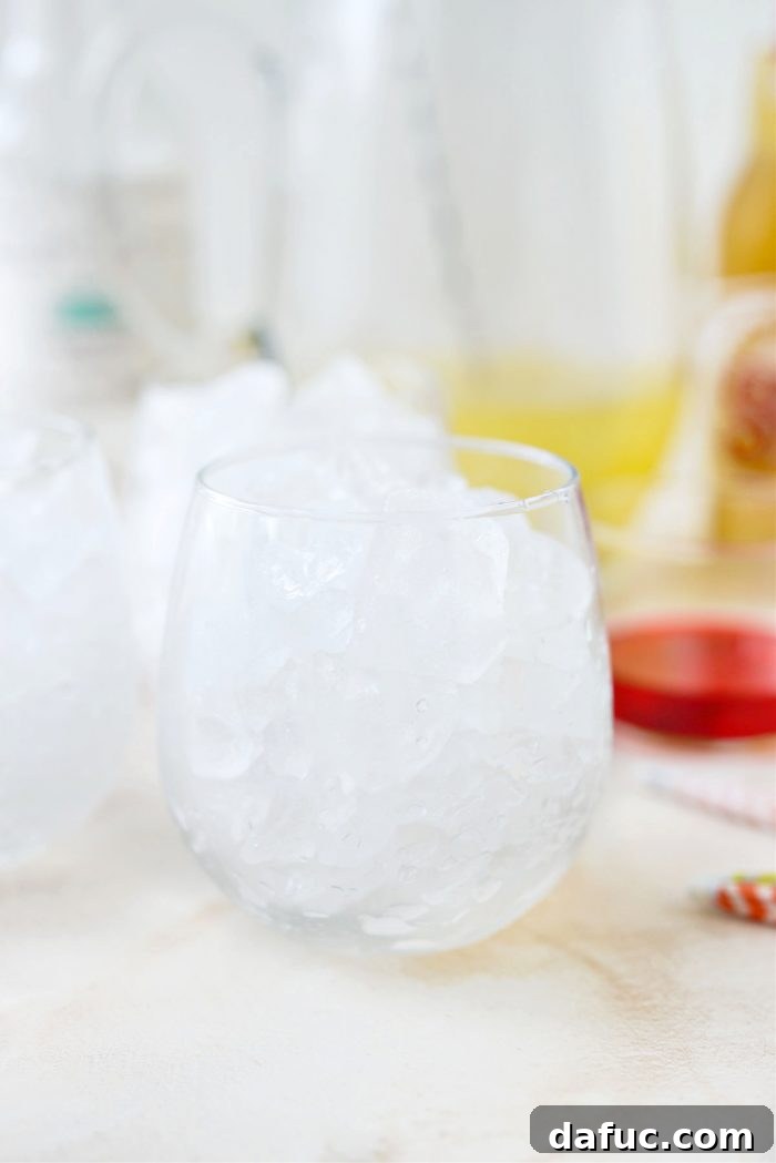 Tropical Tequila Sunrise Shandy 9 Filling cocktail glasses to the brim with ice cubes