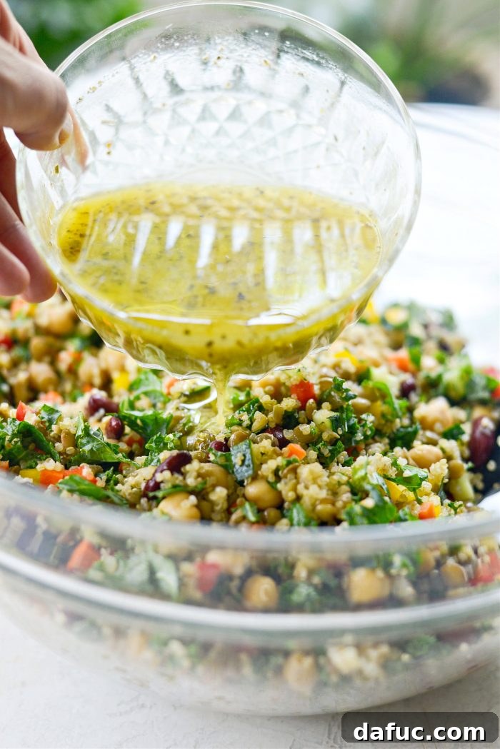 Pouring Lemony Dijon Vinaigrette Over Confetti Picnic Salad