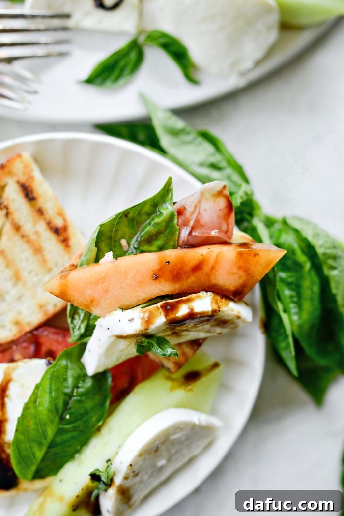 Vibrant Melon Caprese 13 Melon Caprese Platter alongside grilled bread, ready for serving.