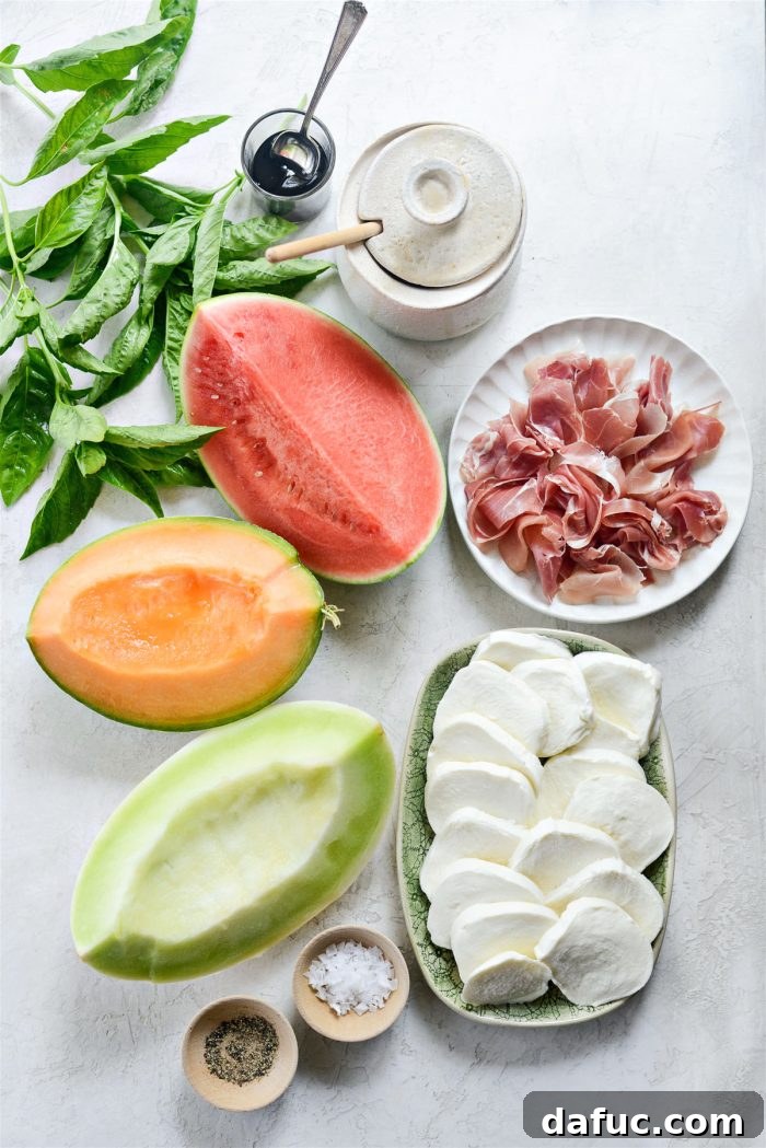 Vibrant Melon Caprese 4 Ingredients for Melon Caprese Platter including watermelon, cantaloupe, honeydew, mozzarella, basil, honey, and balsamic glaze.