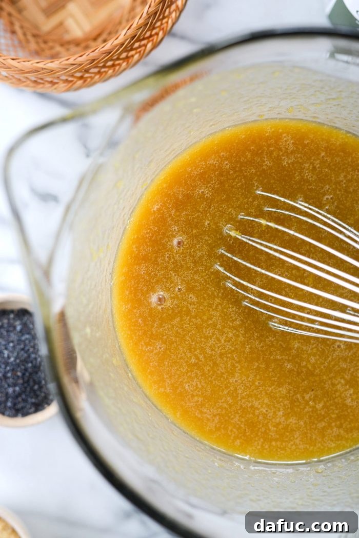 Whisking wet ingredients until thoroughly combined and smooth