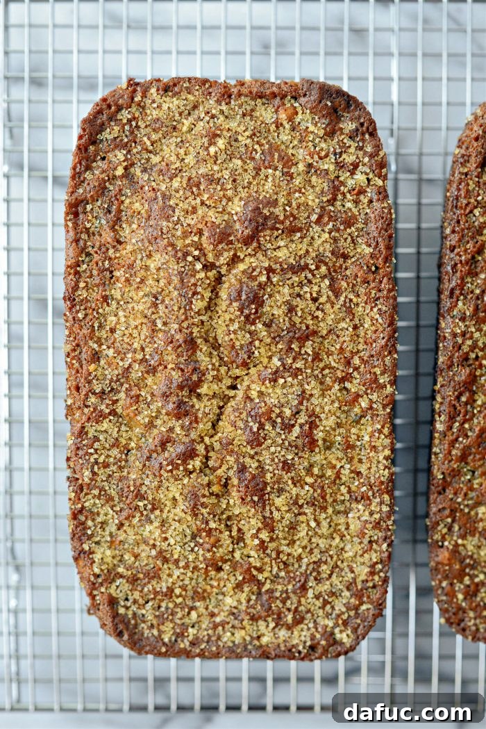 Finished zucchini bread loaves removed from pans, cooling on a wire rack