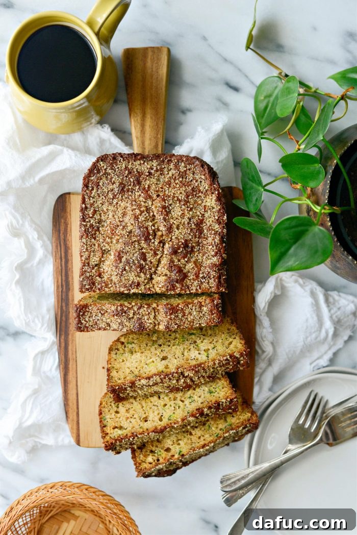 Close-up of a perfectly baked Lemon Poppy Seed Zucchini Bread loaf