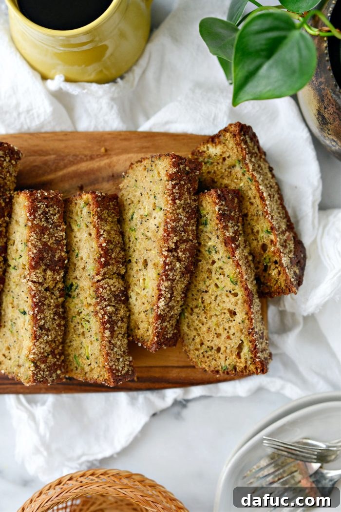 Delicious close-up of a slice of Lemon Poppy Seed Zucchini Bread ready to be enjoyed