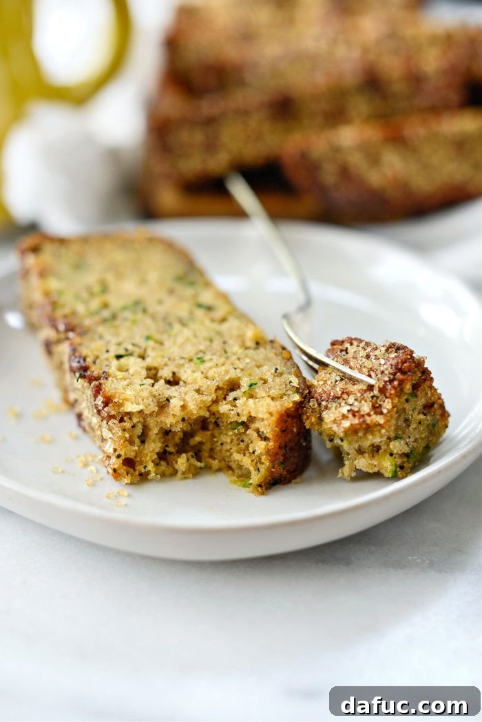 Final close-up of a delicious slice of Lemon Poppy Seed Zucchini Bread