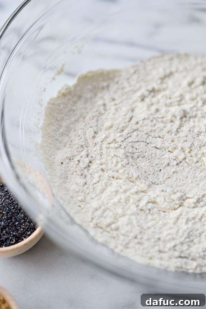 Close-up of sifted dry ingredients in a large mixing bowl