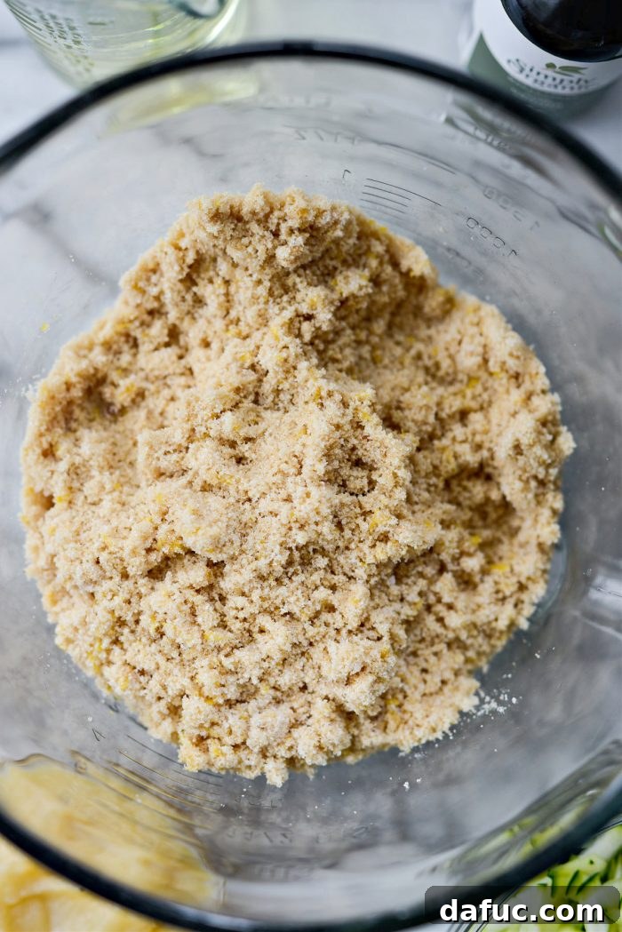 Lemon sugar mixture resembling wet sand after being massaged