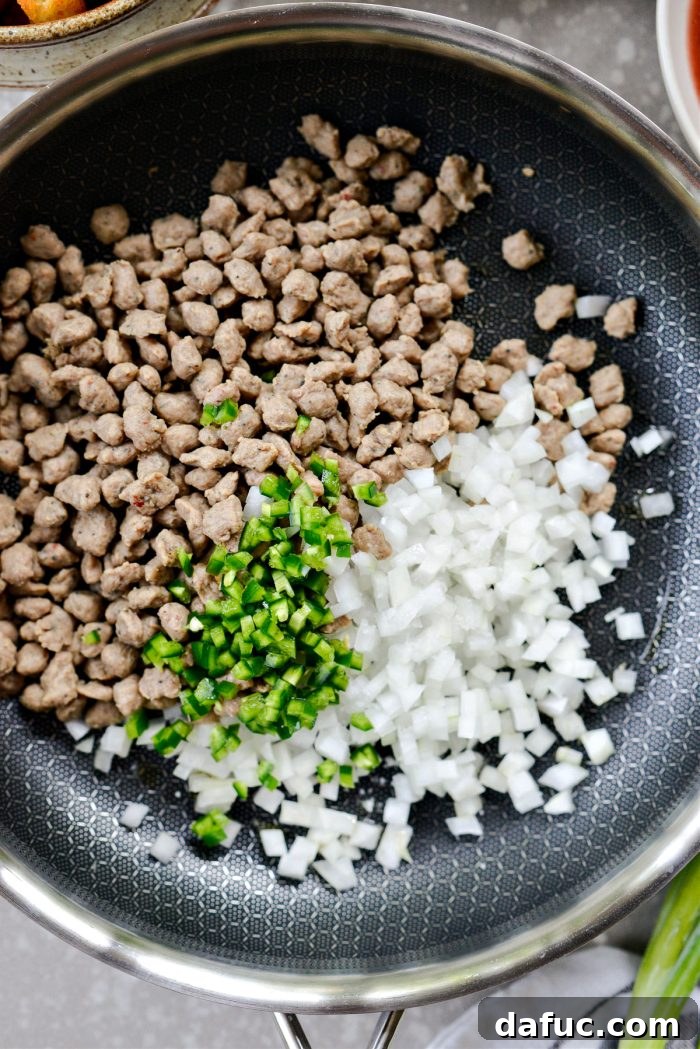 Crispy Hash Brown Morning Burritos 7 Add olive oil, sausage crumbles, diced onion, and jalapeño to a skillet.