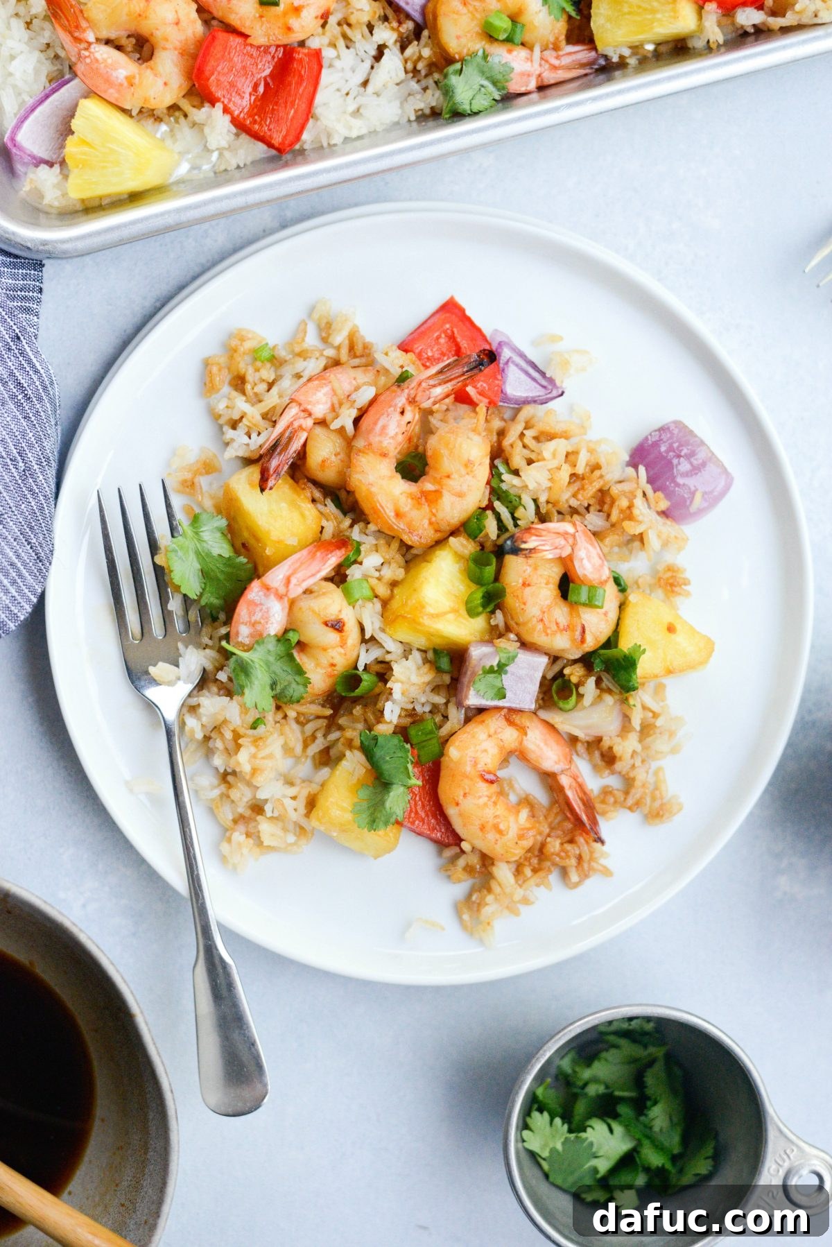 25+ Simple Dinners for Busy Weeknights 7 Sheet Pan Hawaiian Shrimp and Rice Dinner, an easy one-pan meal with tropical flavors.