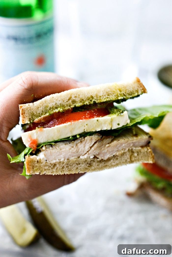 Close-up of the halved Turkey Pesto Sandwich, revealing all layers