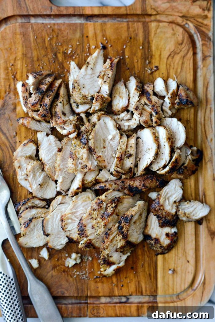 Thinly slicing the rested grilled turkey