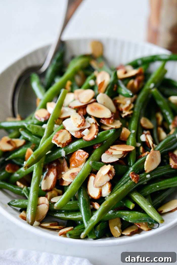 side view of garlicky green beans almondine