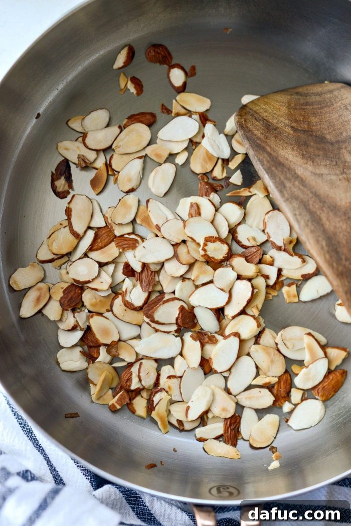 toasted sliced almonds in a skillet.