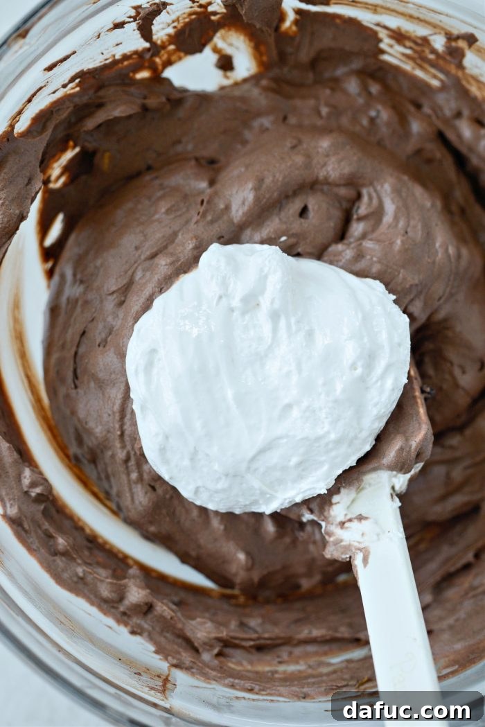 Blissful No-Churn Hash Indulgence 17 Adding marshmallow creme to the no-churn ice cream base