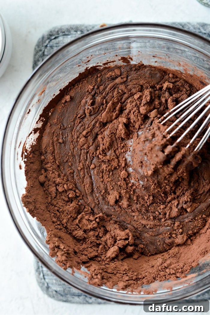 Blissful No-Churn Hash Indulgence 10 Whisking the chocolate, condensed milk, cocoa, vanilla, and salt mixture