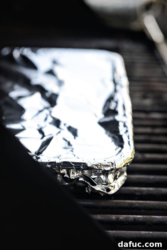 Irresistible Smoked Chile Queso 23 cover with foil
