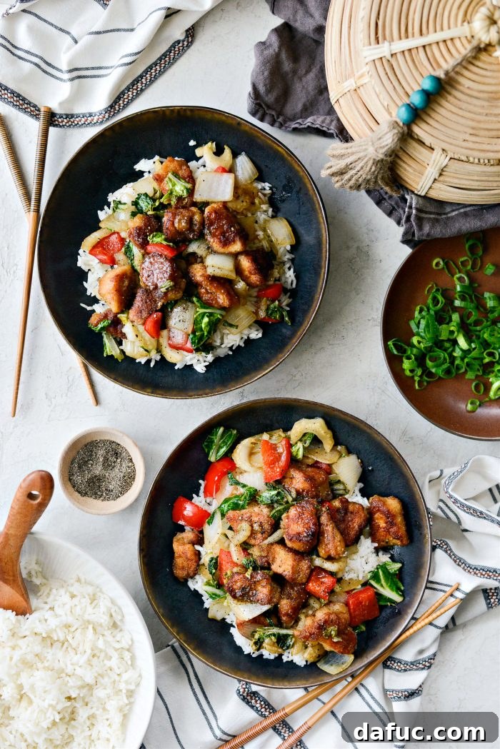 Plated Black Pepper Chicken Stir-fry over white rice
