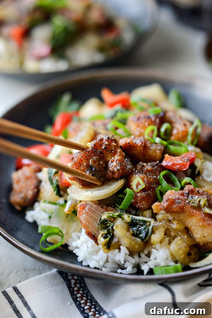 Black Pepper Chicken Stir-fry, close-up with focus on chicken and vegetables