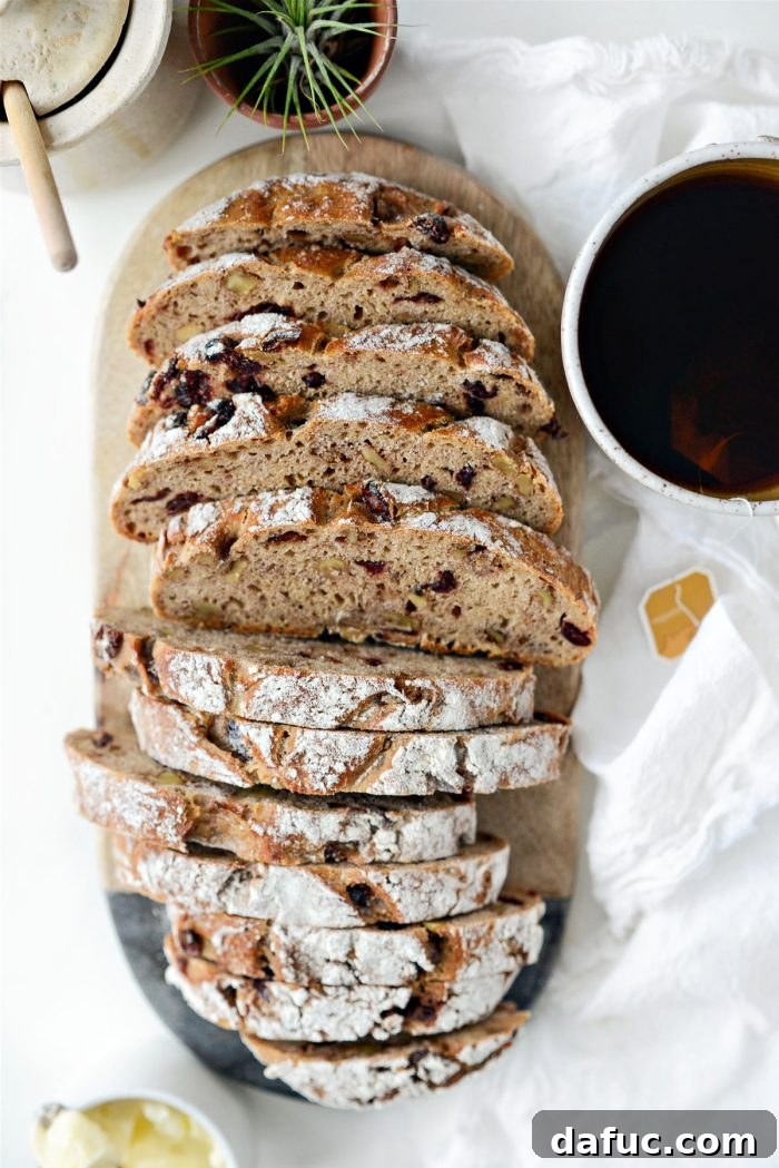 Effortless Cranberry Walnut Loaf 3 Close-up of a loaf of No-Knead Cranberry Walnut Bread, showing cranberries and walnuts