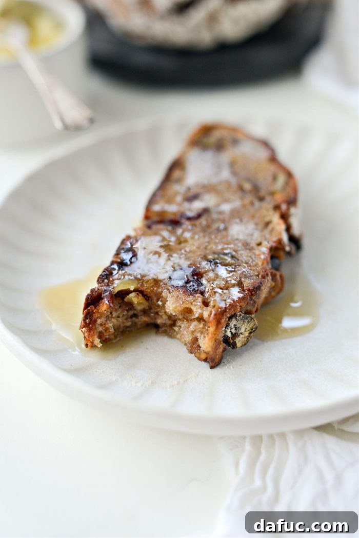 Effortless Cranberry Walnut Loaf 24 Multiple slices of No-Knead Cranberry Walnut Bread stacked on a plate