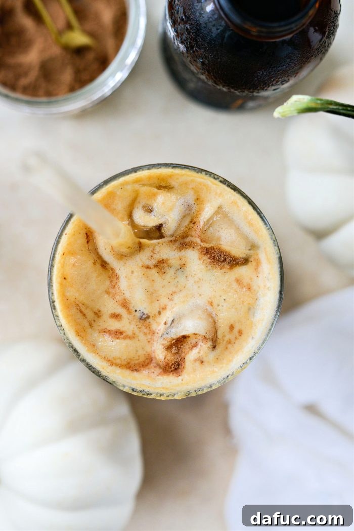 Fall's Creamy Pumpkin Brew 17 Pumpkin Cream Cold Brew Coffee with a cozy background