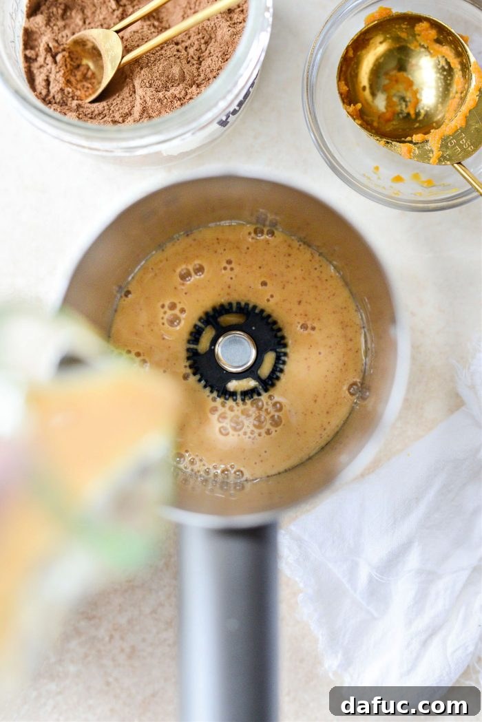 Fall's Creamy Pumpkin Brew 10 Frothing pumpkin mixture with a frother