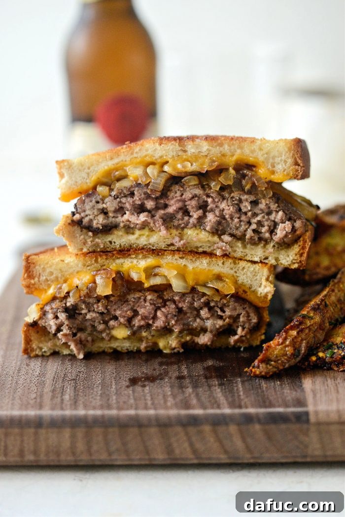 The Ultimate Beef Patty Melt 18 A freshly sliced Classic Beef Patty Melt revealing the enticing layers of beef, onions, and melted cheese