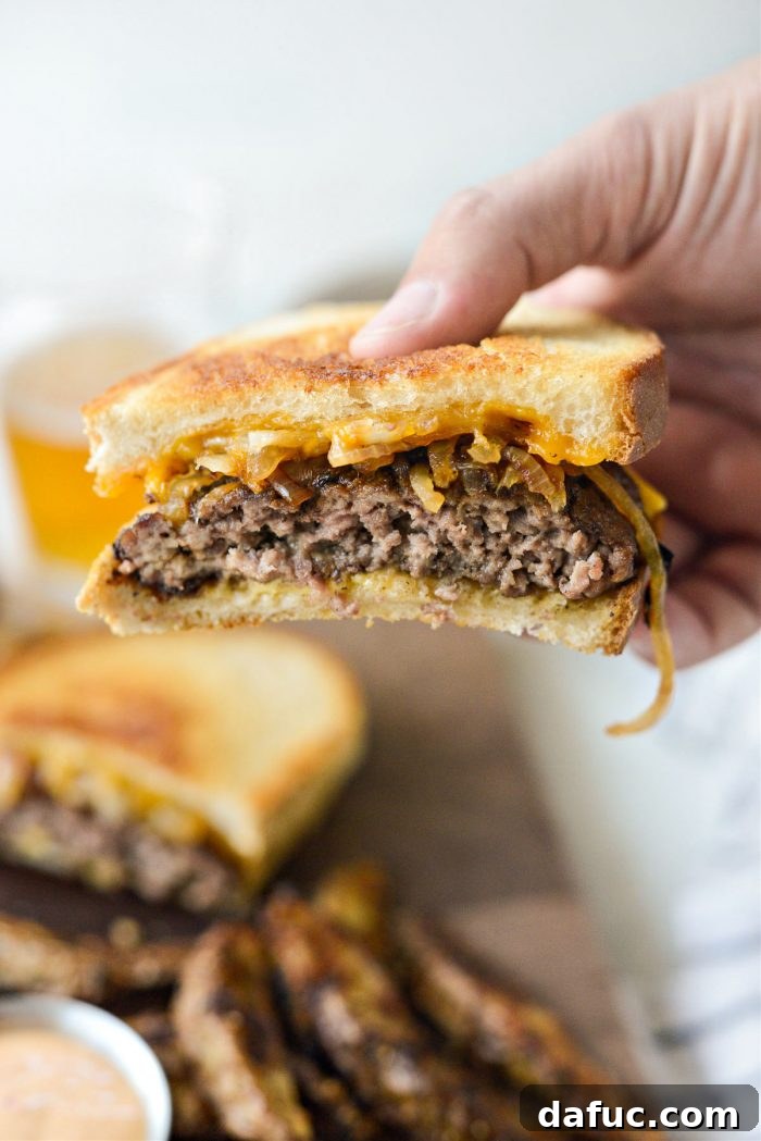 The Ultimate Beef Patty Melt 3 Close-up of a perfectly cooked Classic Beef Patty Melt, showing the melted cheese and tender patty