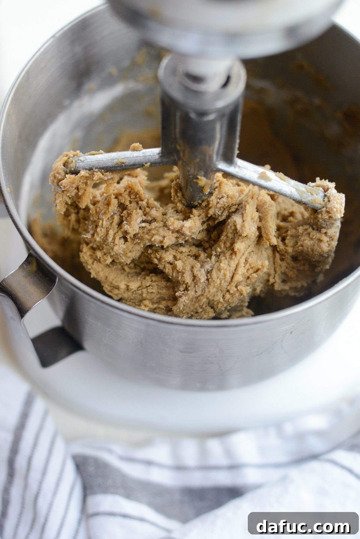 Golden Toffee Oatmeal Chocolate Chip Cookies 13 Mixing dry ingredients into the wet batter on low speed until just combined.