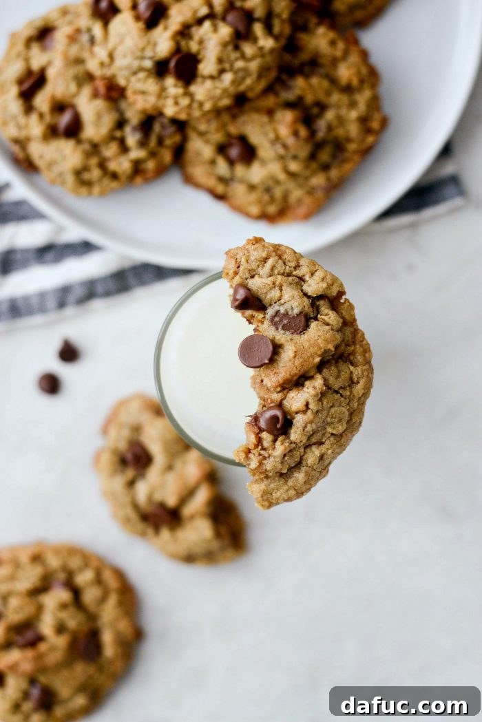 Golden Toffee Oatmeal Chocolate Chip Cookies 3 Close-up of golden brown Oatmeal Chocolate Chip Toffee Cookies, showcasing their delightful texture and toppings.