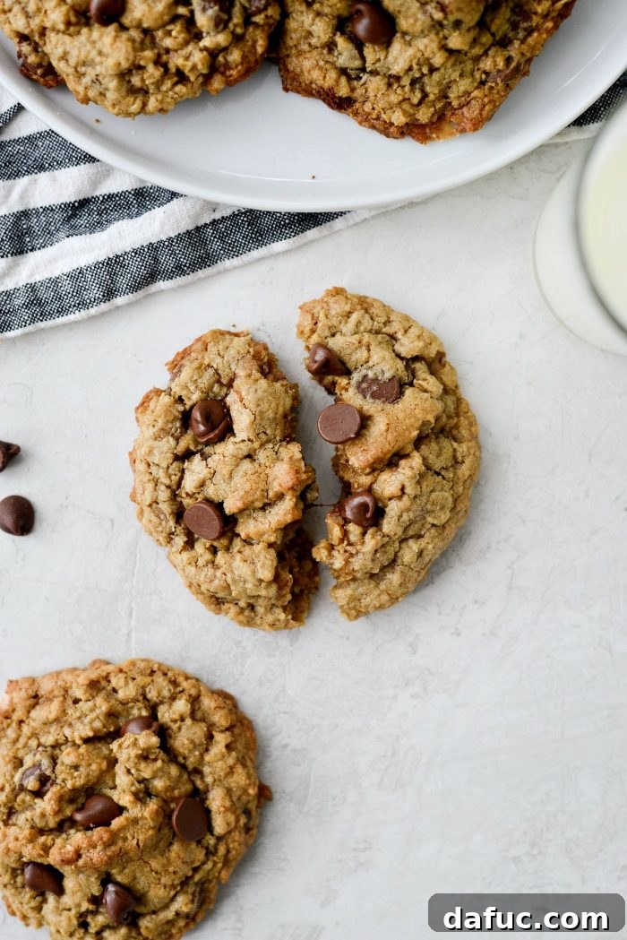 Golden Toffee Oatmeal Chocolate Chip Cookies 23 A stack of Oatmeal Chocolate Chip Toffee Cookies, highlighting the crispy, candy-like bottoms and generously filled interiors.