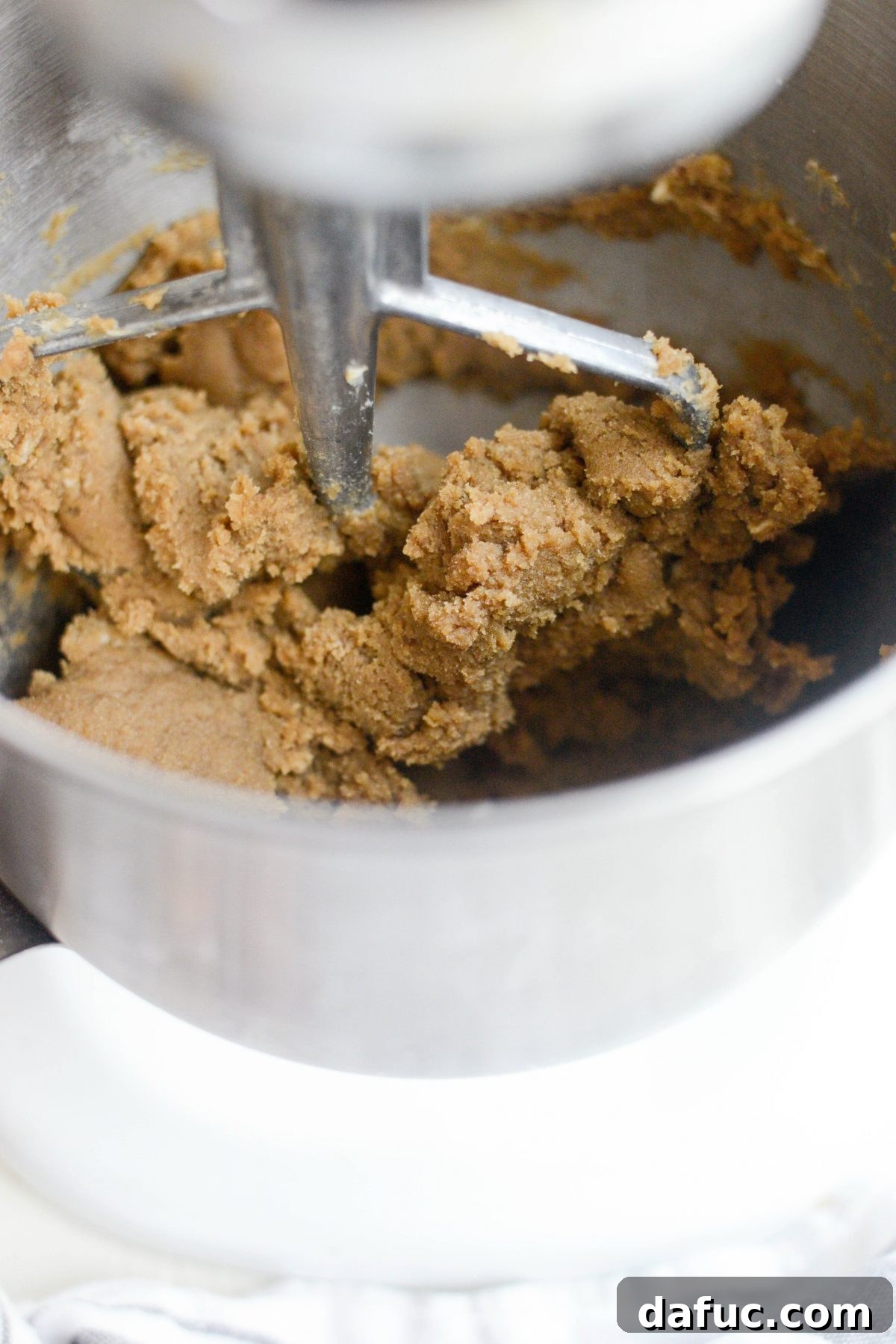 Golden Toffee Oatmeal Chocolate Chip Cookies 8 Adding rich dark brown sugar to creamed butter, continuing to mix until light and fluffy.