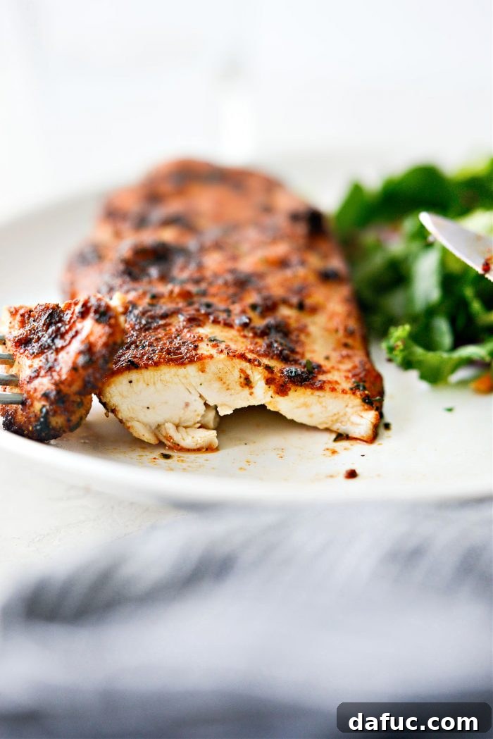 Close-up of a sliced Air Fryer Chicken Breast revealing its juicy interior.