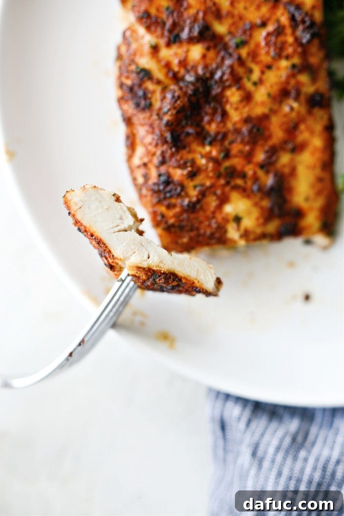 A beautifully plated dish of Air Fryer Chicken Breasts with garnishes.