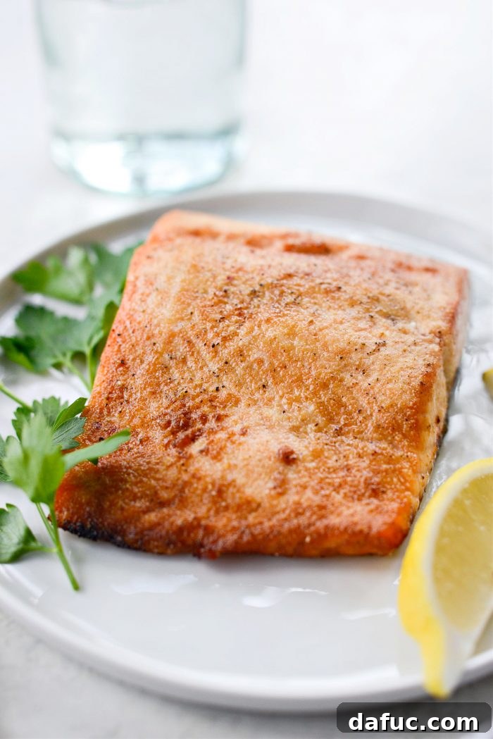 Easy Air Fryer Salmon 2 Deliciously cooked air fryer salmon with crispy edges, ready to serve.