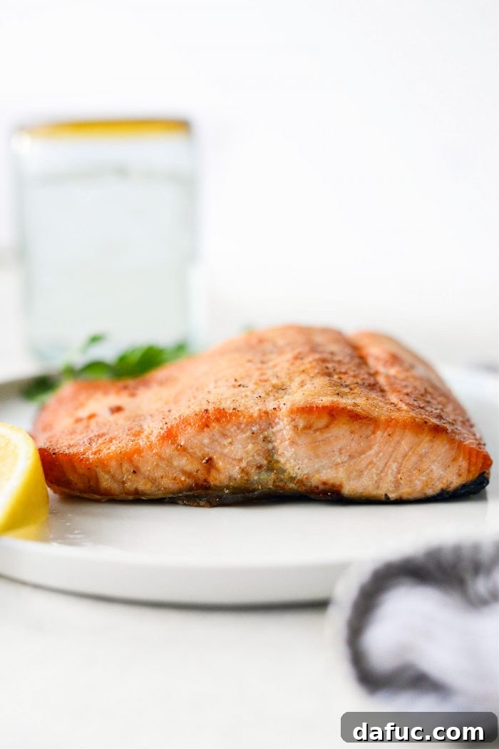 Easy Air Fryer Salmon 12 Another perspective of air fryer salmon ready to be served, highlighting its flaky texture.