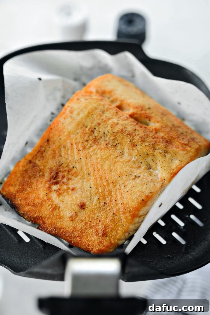 Easy Air Fryer Salmon 10 Close-up of perfectly air fried salmon, flaky and golden brown.