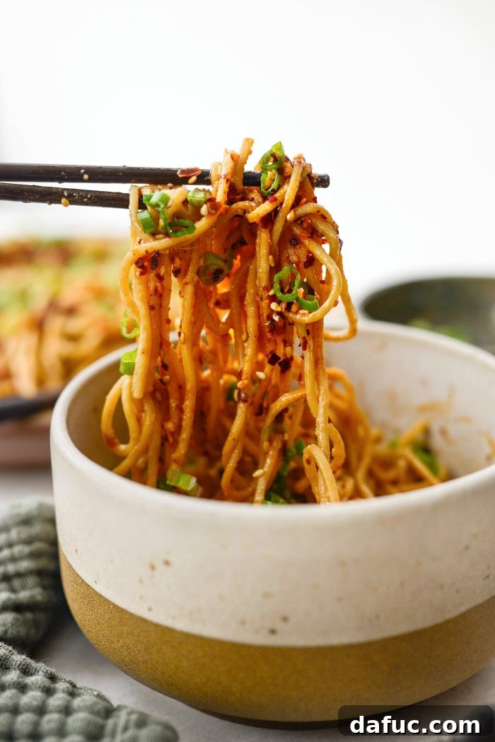 Fiery Garlic Sesame Noodles 19 Another appealing view of Spicy Garlic Sesame Noodles in a serving bowl, perfectly coated and ready to eat.