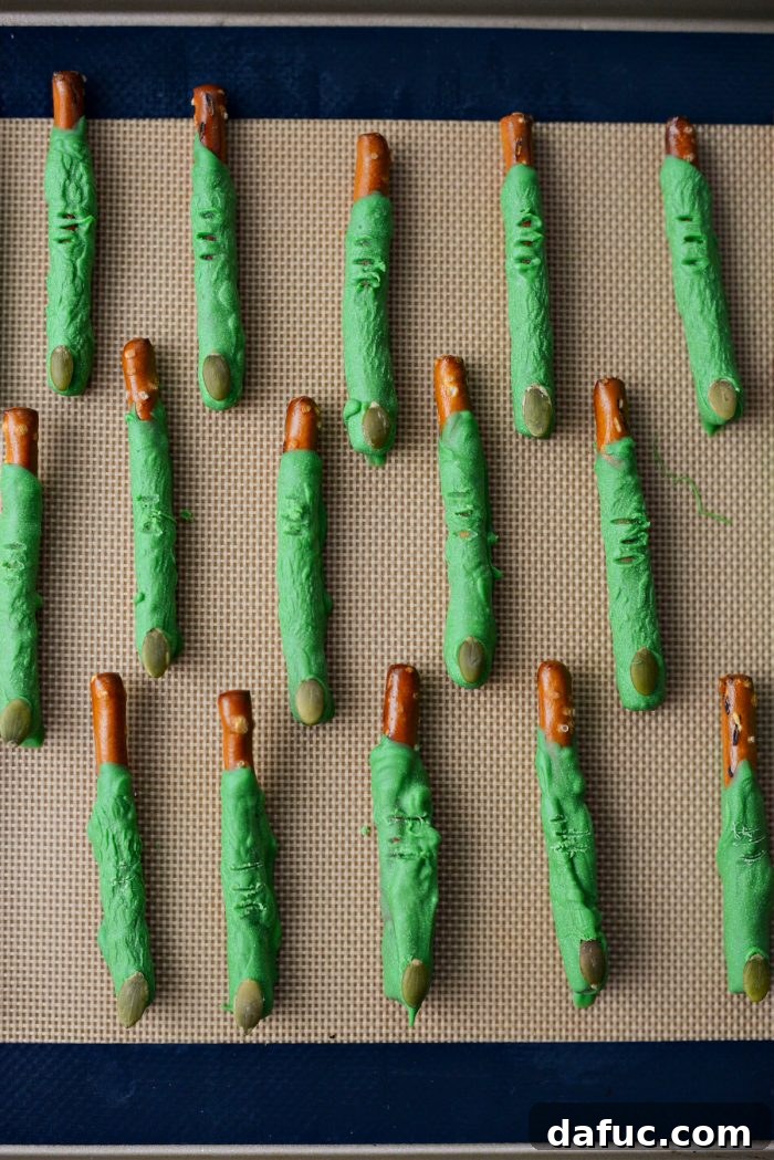 Ghoulish Grabbers 11 A close-up of a chocolate-dipped pretzel, showing the deliberately uneven, gnarly texture.