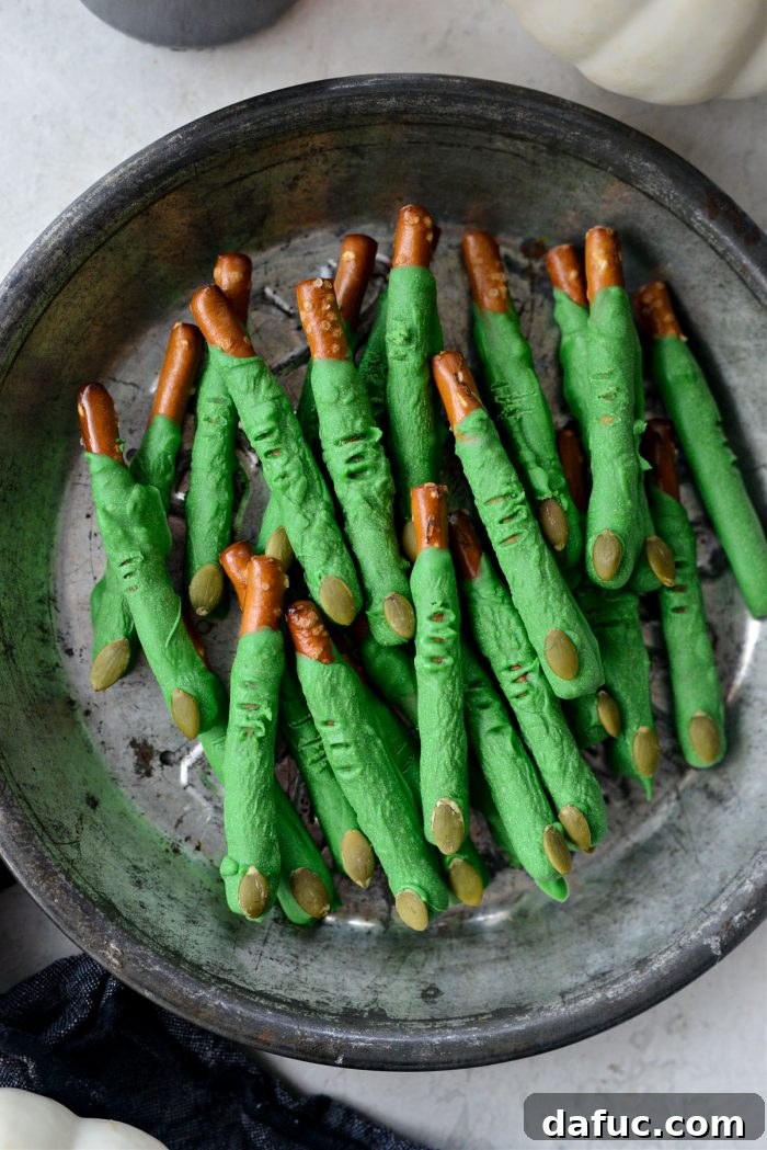 Enchanted Digits 12 Witch Fingers on parchment paper with pumpkin seeds attached and knuckle wrinkles made