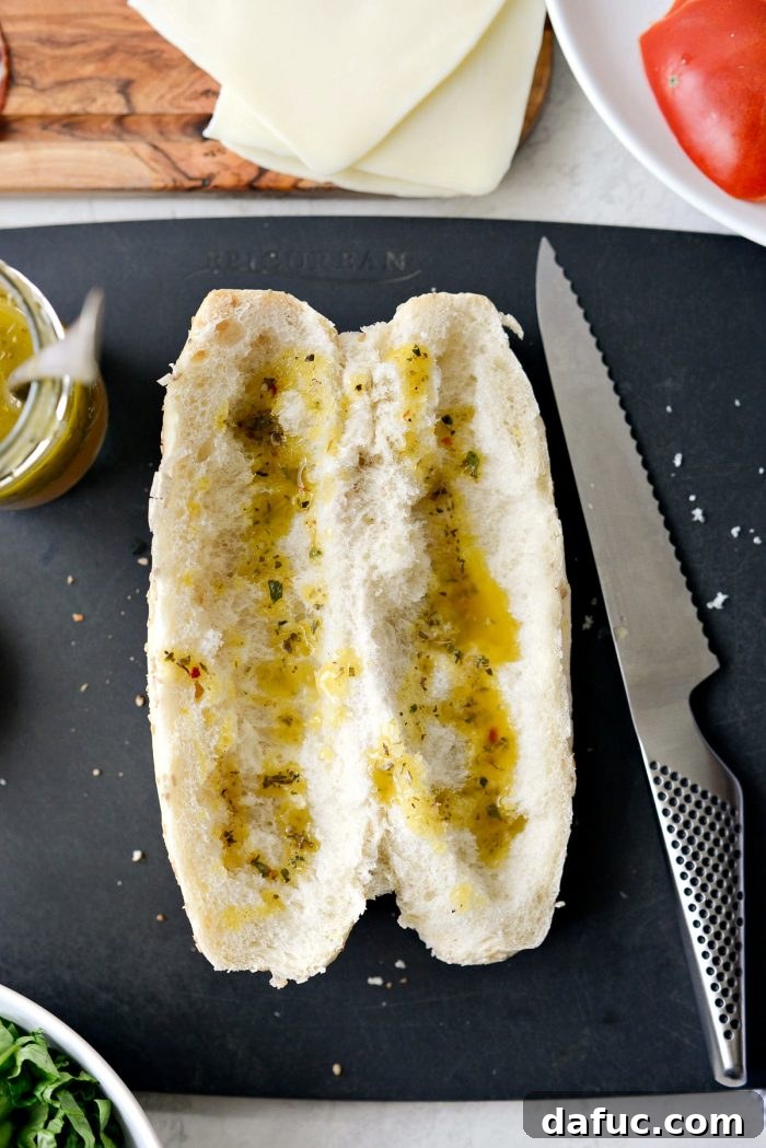 Zesty Italian Heroes 12 sub bun with dressing drizzled onto the inside of the bread